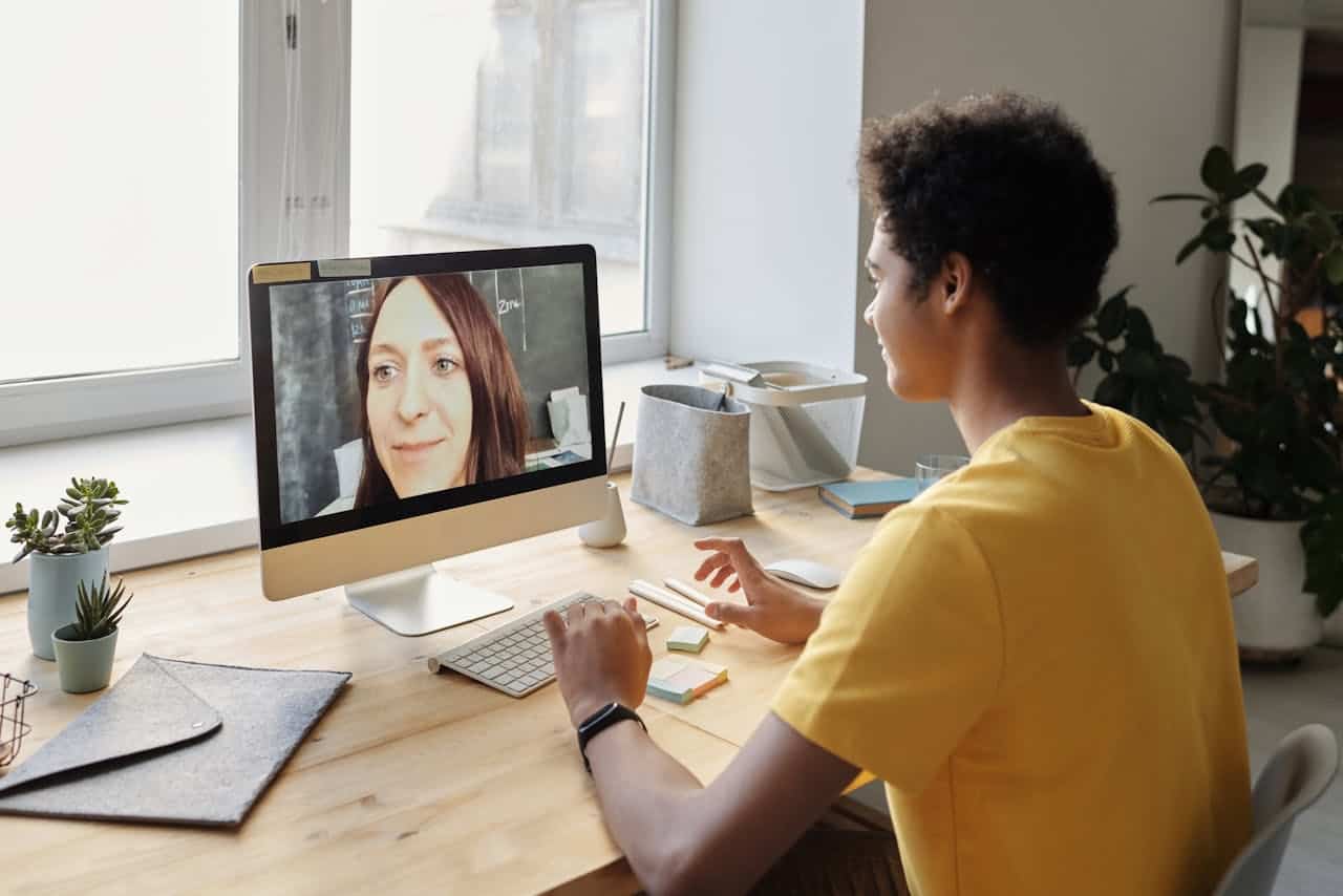 Boy in Yellow T-shirt Using a computer